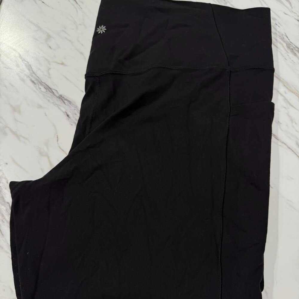 Athleta Black Salutation Stash Tight with pockets